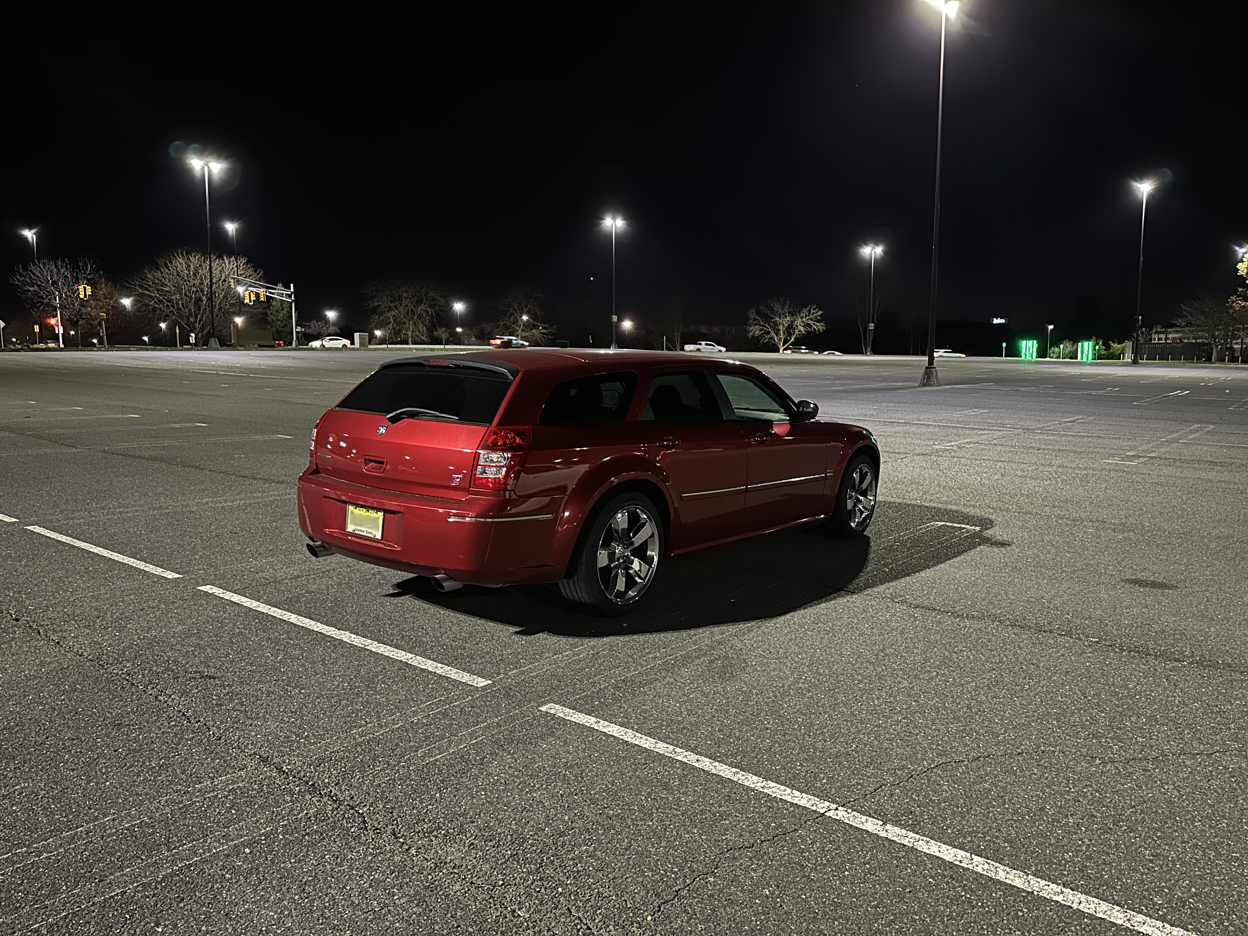red car empty parking night